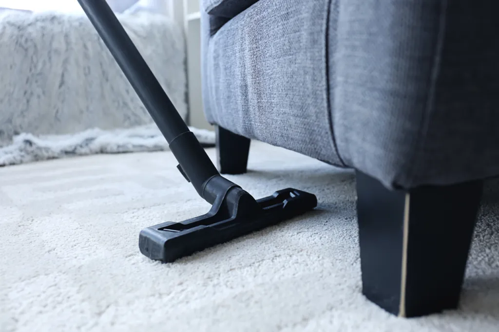 Vacuuming a plush carpet