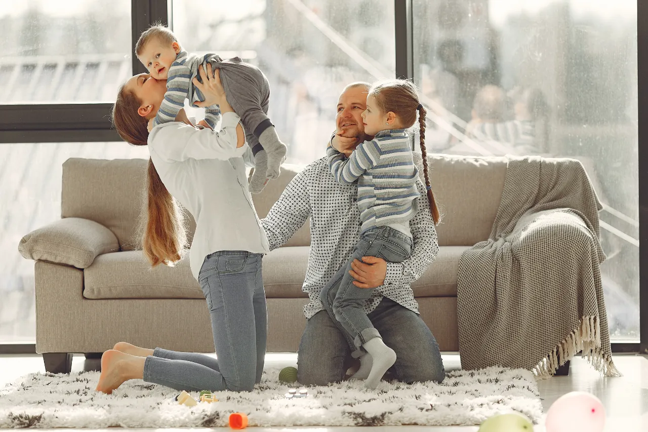 A happy family relaxing on a freshly cleaned carpet